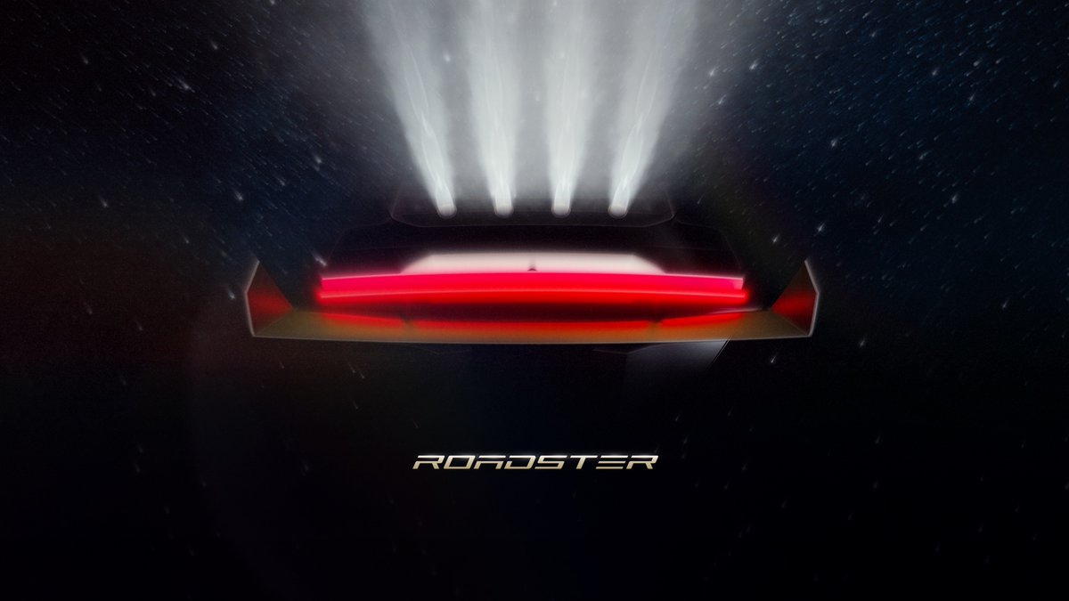 The Roadster with its thrusters firing at Tesla's event